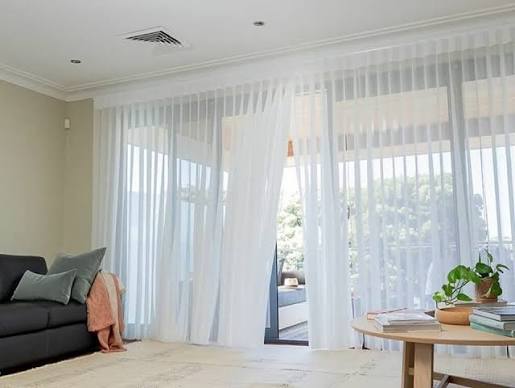 Custom window curtains installed in an Ahmedabad bedroom by best curtain dealers in Gota